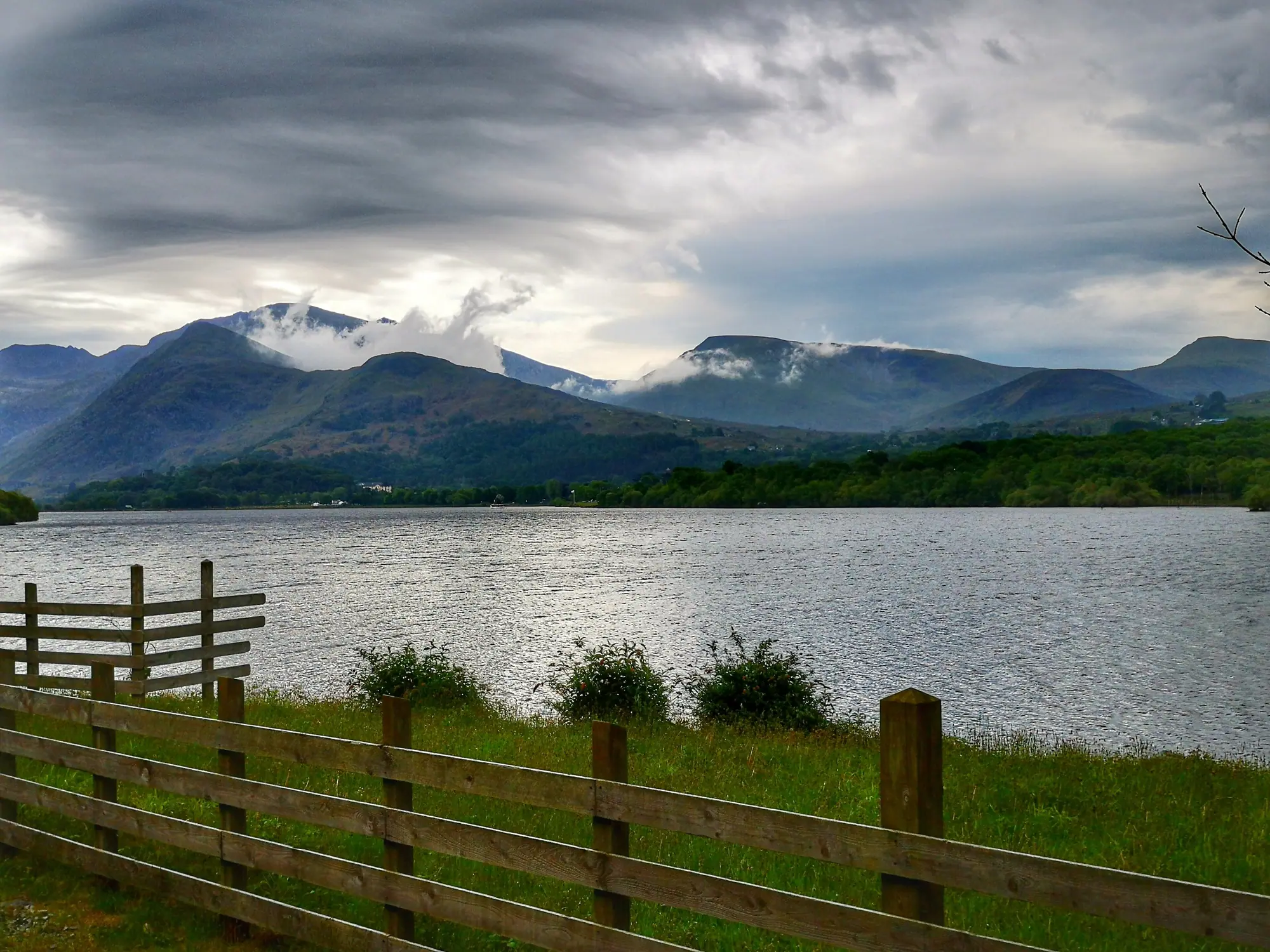 Mist over the mountains and a lake in Eryri, Snowdonia