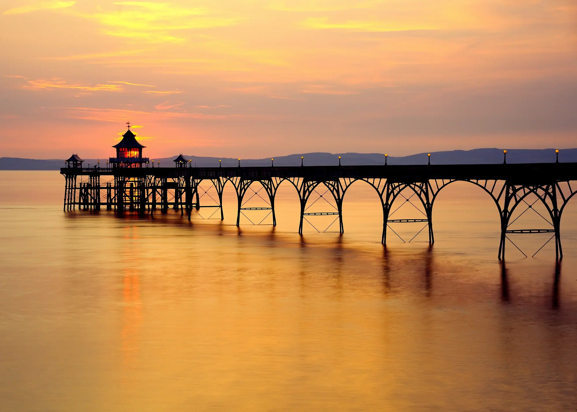 Clevedon Pier silhouetted against a golden sunset